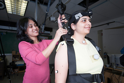 Two women testing kinesthetic technology