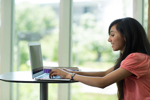 A student using her laptop